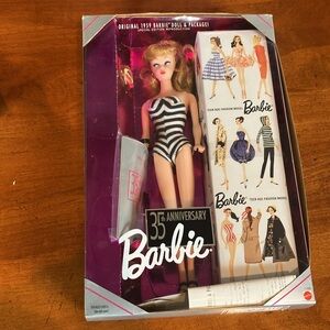 35th Anniversary Barbie with original advertisement.